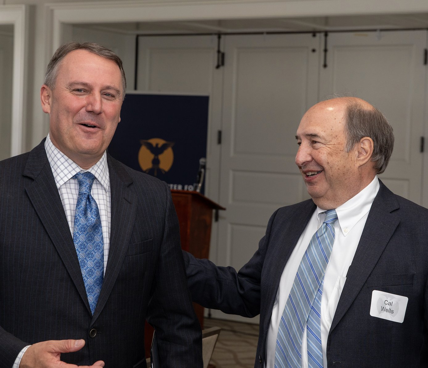 Cal Wells, board chairman, with Speaker Jason White